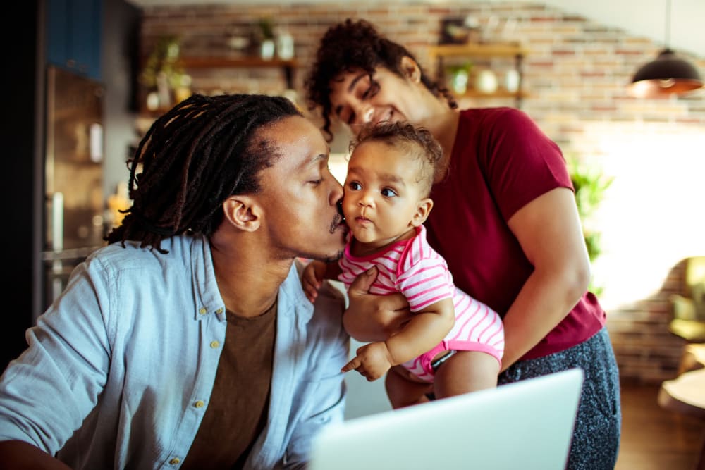 Father kissing his daughter at City View Apartments in Nashville, Tennessee