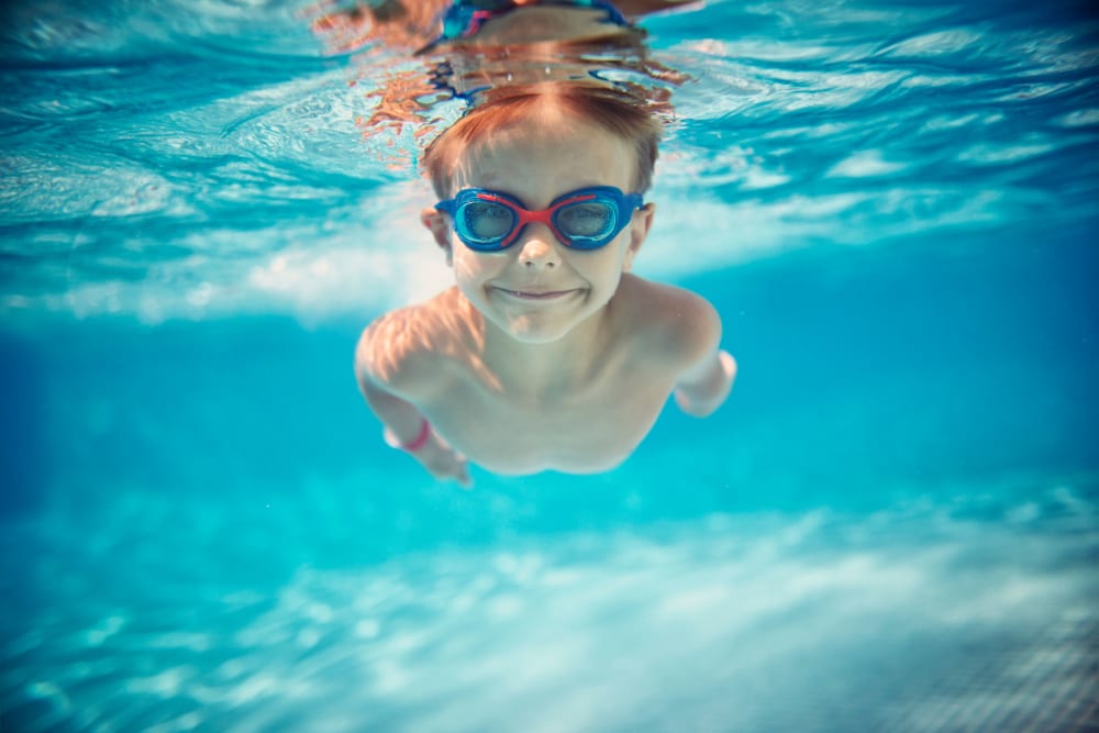 Kid swimming in the pool at City View Apartments in Nashville, Tennessee