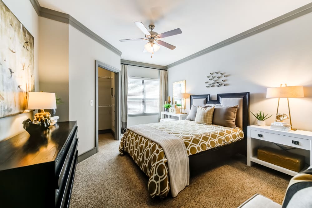Well decorated model bedroom at The Sovereign in Fort Worth, Texas