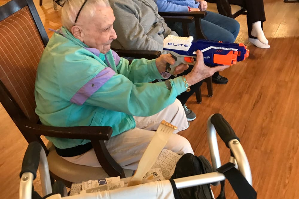 Resident playing with a Nerf gun at Edencrest at Green Meadows in Johnston, Iowa