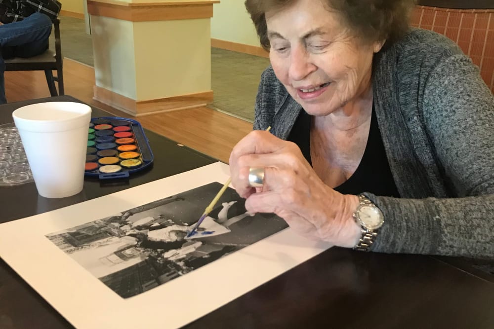 Resident enjoying time painting at Edencrest at Riverwoods in Des Moines, Iowa