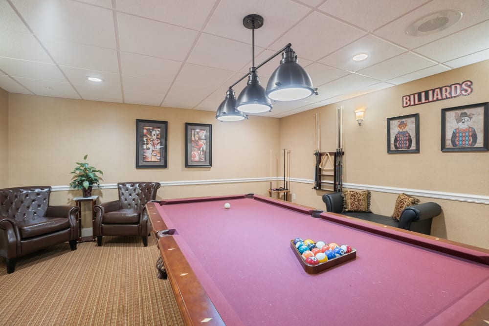 Activity room with a billiards table and other games at The Hearth at Franklin in Franklin, Tennessee