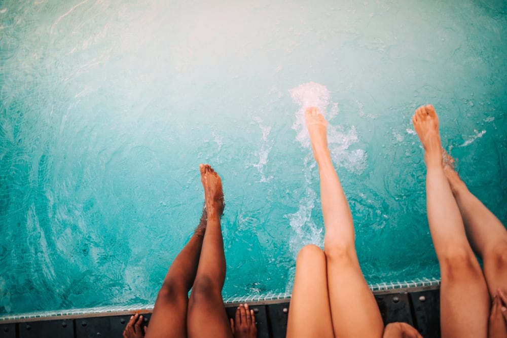 Three women enjoying the pool at City View Apartments in Nashville, Tennessee