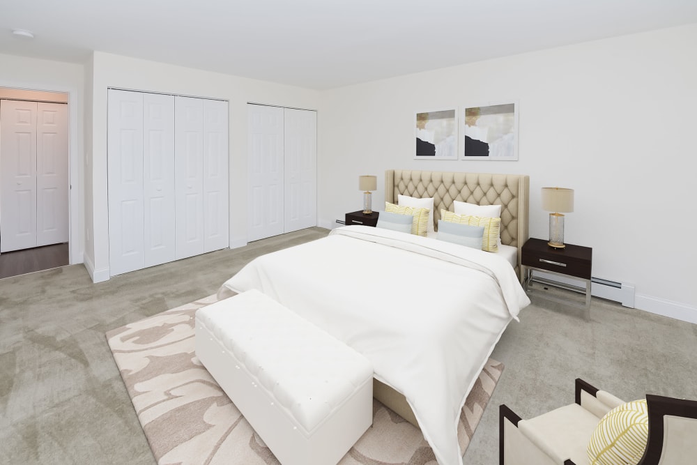 Master bedroom with plush carpeting and ample closet space at Kingswood Apartments & Townhomes in King of Prussia, Pennsylvania