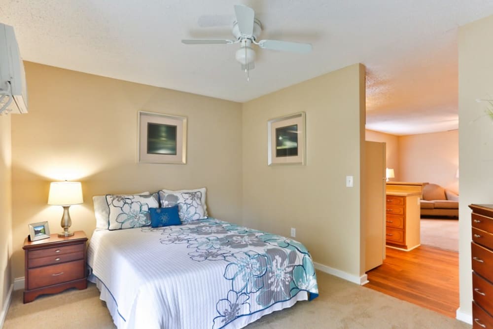 Bedroom with plush carpeting at Huntersville Apartment Homes in Huntersville, North Carolina