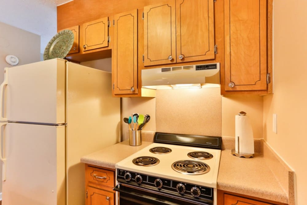 Kitchen with white appliances at Huntersville Apartment Homes in Huntersville, North Carolina