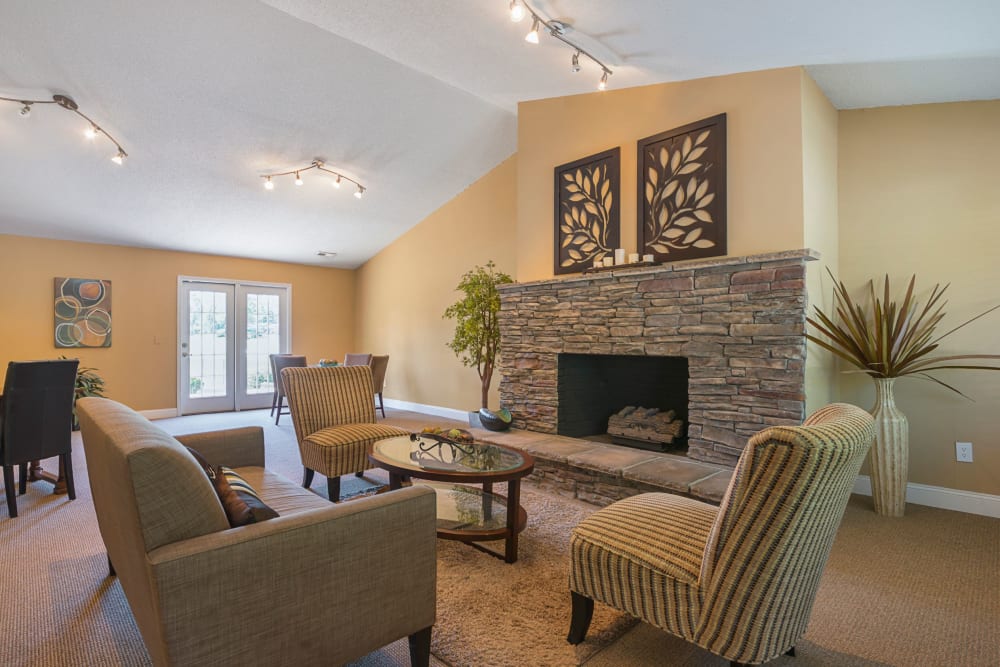Resident clubhouse with a beautiful stone fireplace at Lakewood Apartment Homes in Salisbury, North Carolina