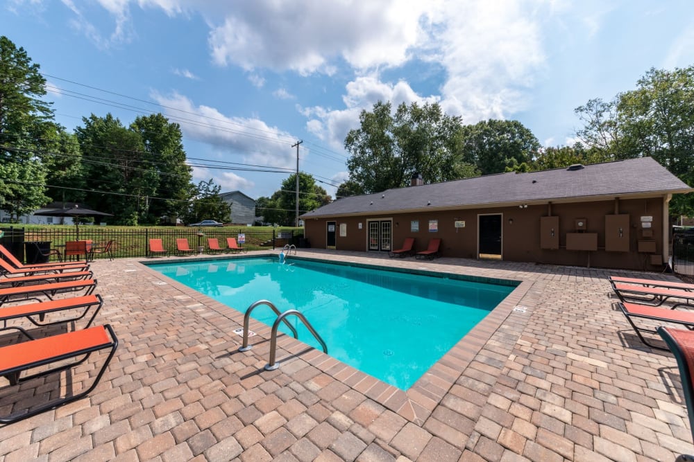 Swimming pool with a large sundeck at Waters Edge Apartment Homes in Concord, North Carolina