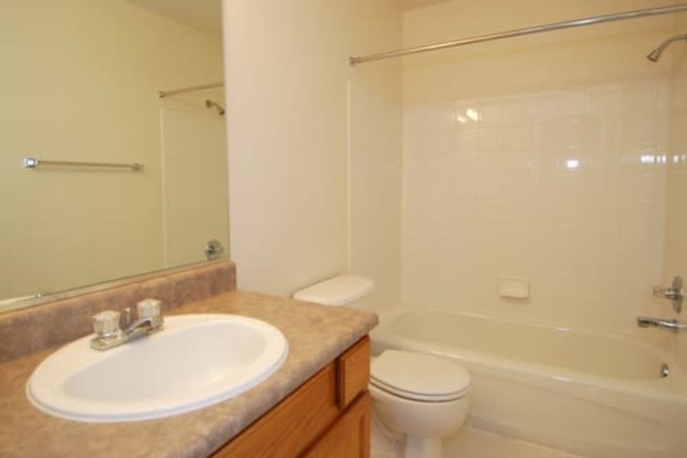 a tidy bathroom at Reserve at Centerra Apartment Townhomes in Loveland, Colorado