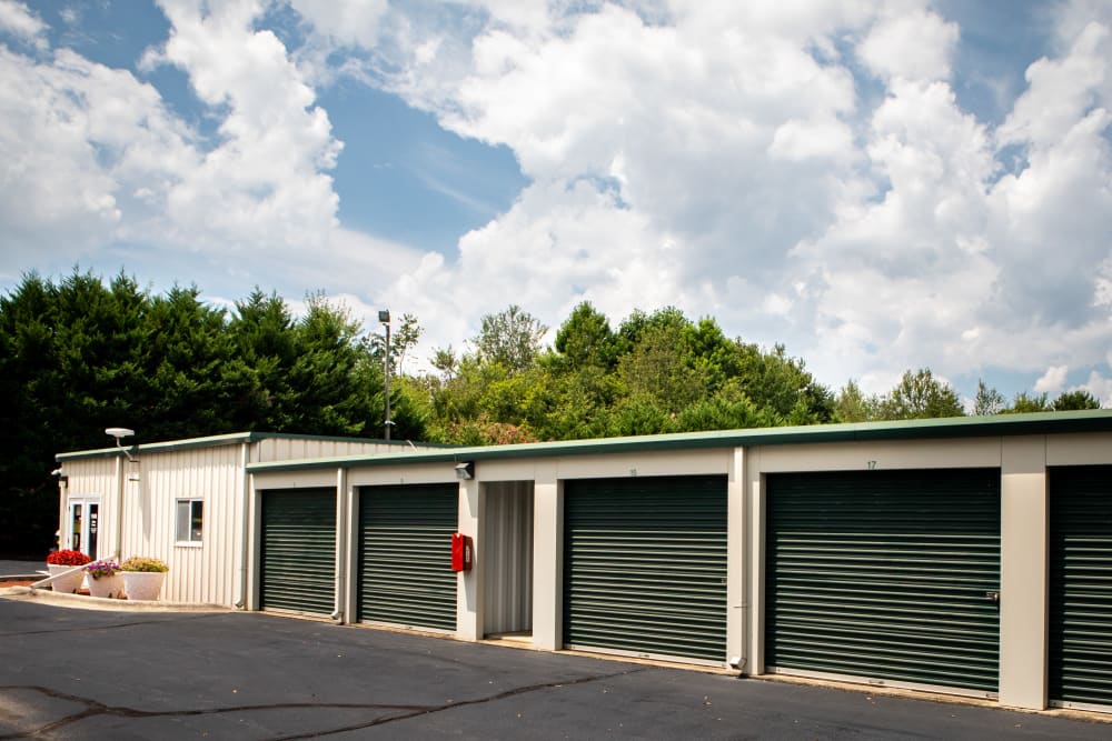 outdoor units with green doors at AAA Self Storage at Pleasant Ridge Rd in Greensboro, North Carolina
