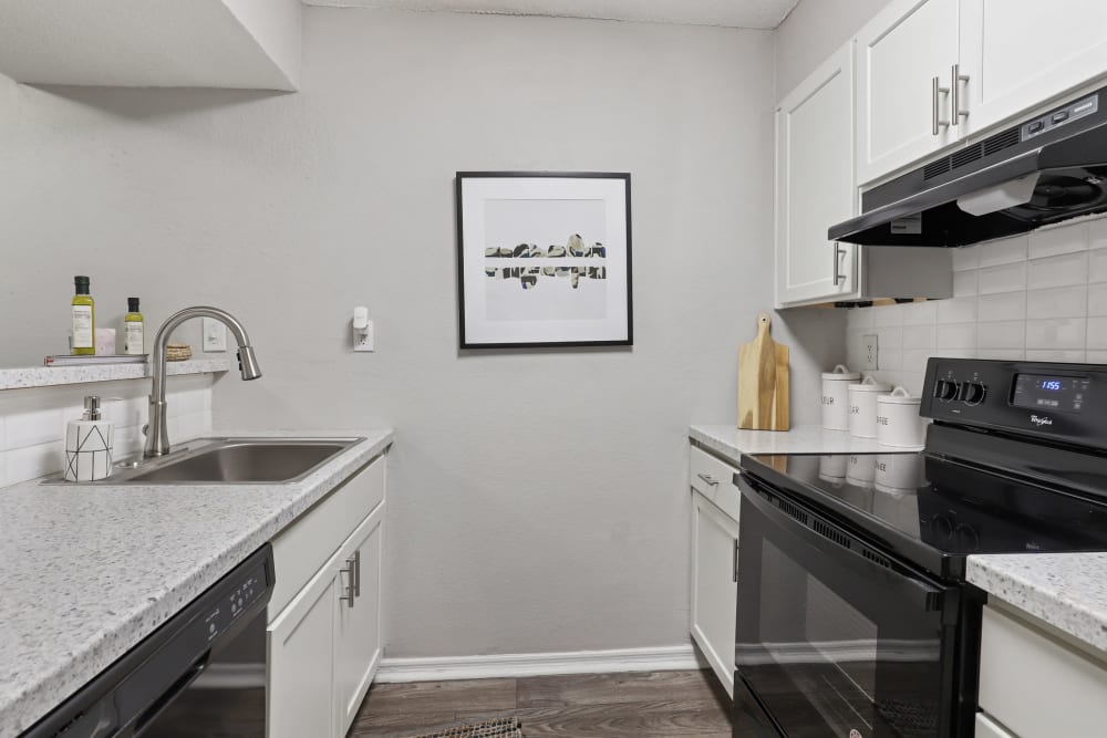 Kitchen with granite counters at The Alcove in Smyrna, Georgia