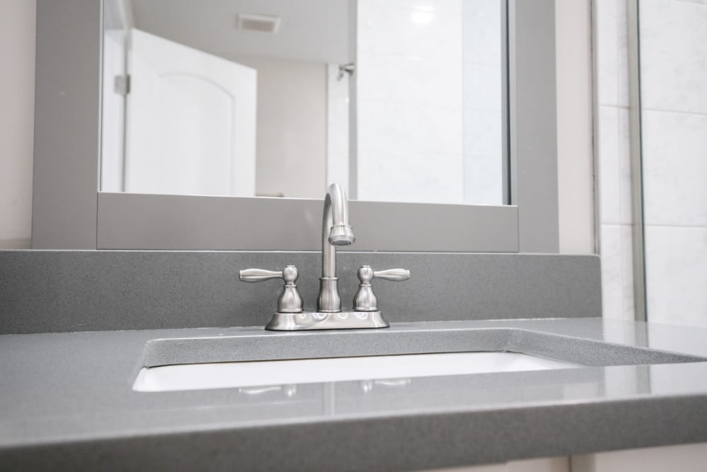 Sink with granite counters at The BelAire Apartment Homes in Marietta, Georgia