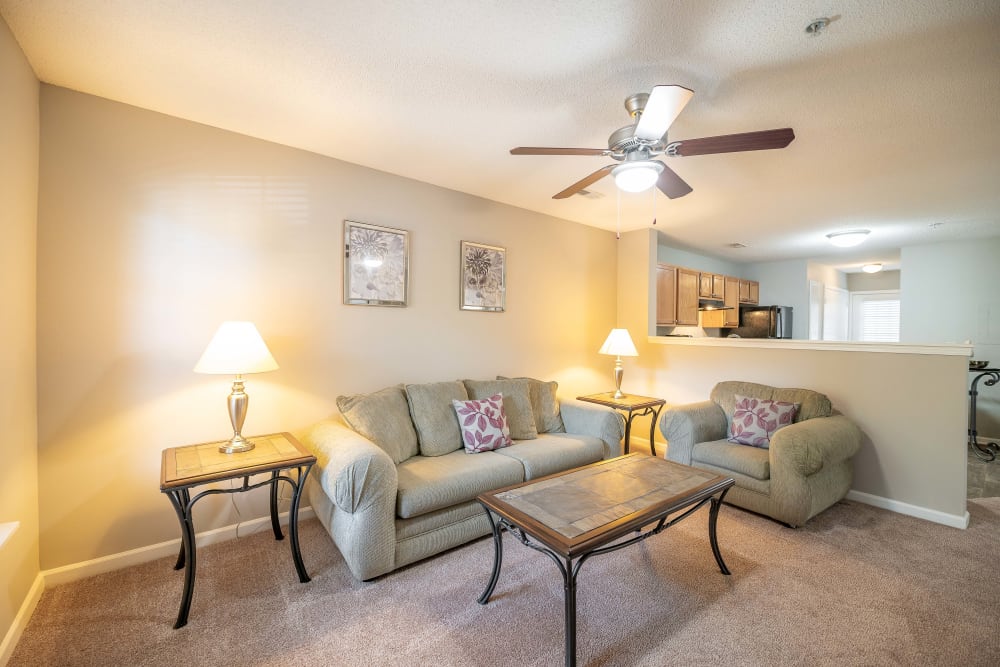 Spacious living room with a ceiling fan at The Village at Brierfield Apartment Homes in Charlotte, North Carolina