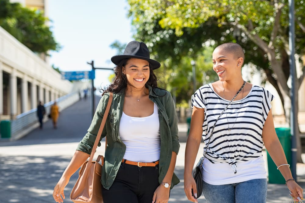 Happy women shopping near Lynn York Apartments in Irvington, New Jersey