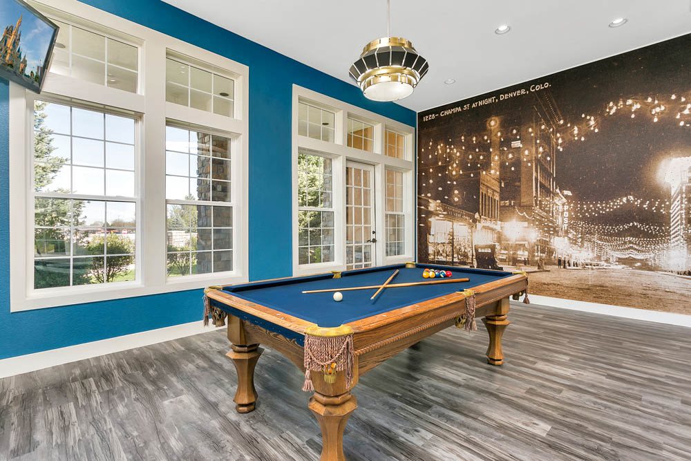 The trendy clubhouse with a billiards table at Crestone Apartments in Aurora, Colorado