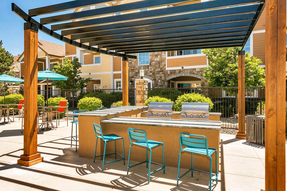 A poolside grilling area at Crestone Apartments in Aurora, Colorado