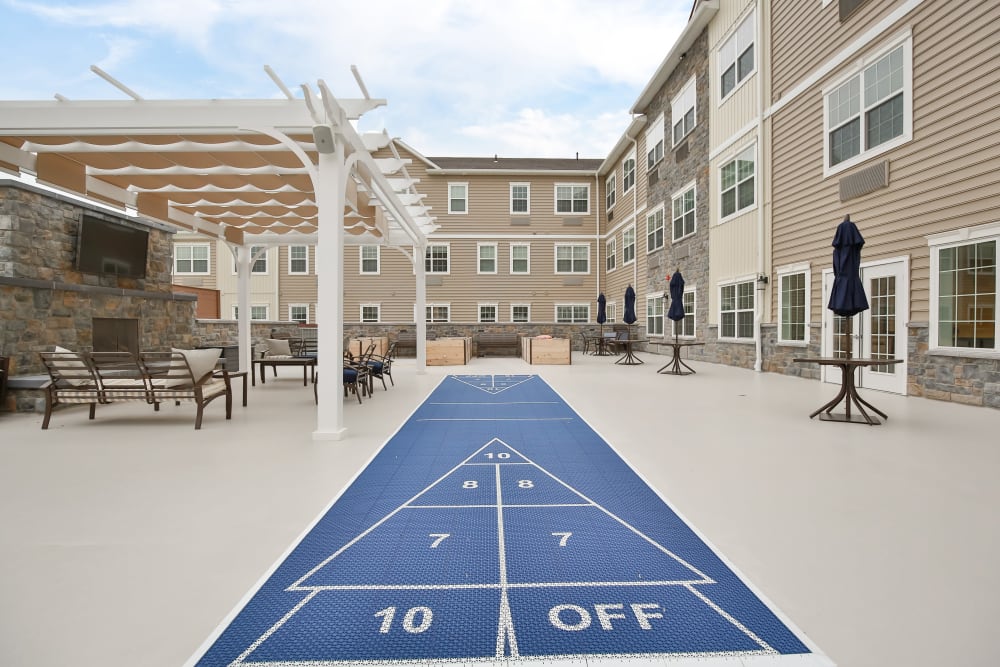 Games on the patio at Merrill Gardens at Glen Mills in Glen Mills, Pennsylvania. 