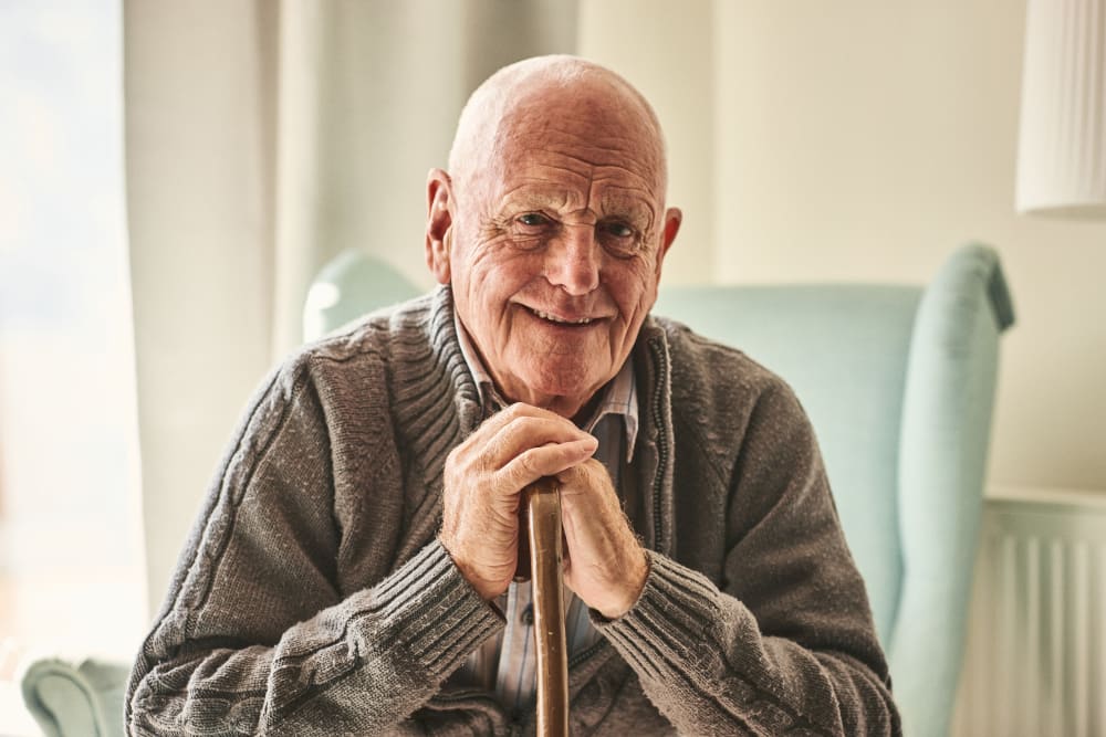 Resident smiling with a cane at Harmony at Bellevue in Nashville, Tennessee