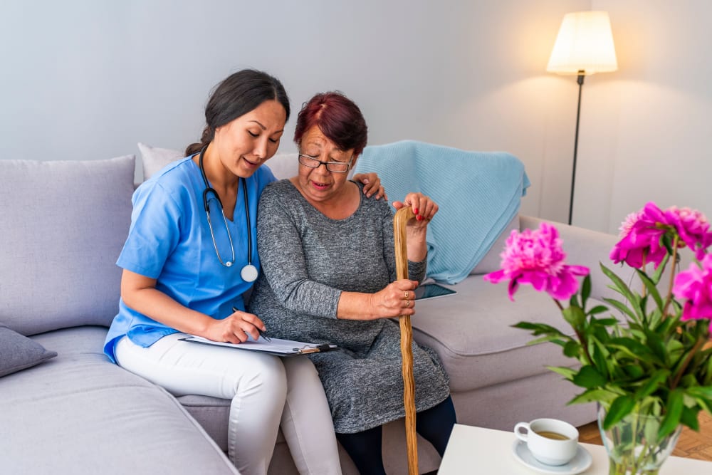 Staff reviews care plan with resident at Arlington Place of Pocahontas in Pocahontas, Iowa