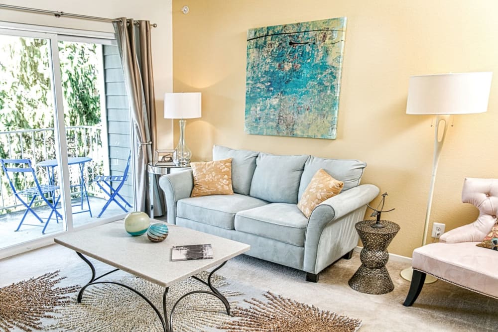 Living room with patio access at The Views at Laurel Lakes in Laurel, Maryland