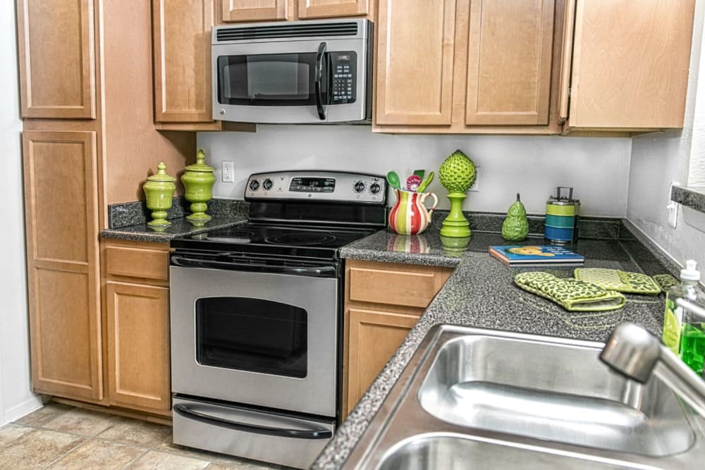 Kitchen with stainless steel appliances at The Views at Laurel Lakes in Laurel, Maryland