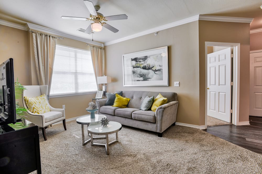 Living room with large windows at Bella Springs Apartments in Colorado Springs, Colorado