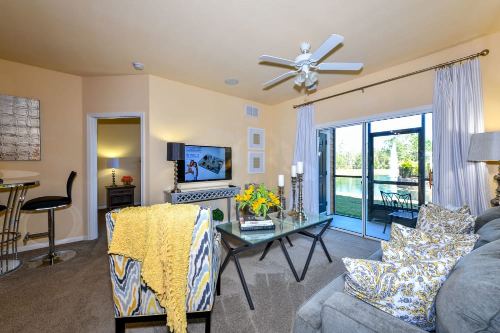 Living room with patio access at Courtney Isles in Yulee, Florida