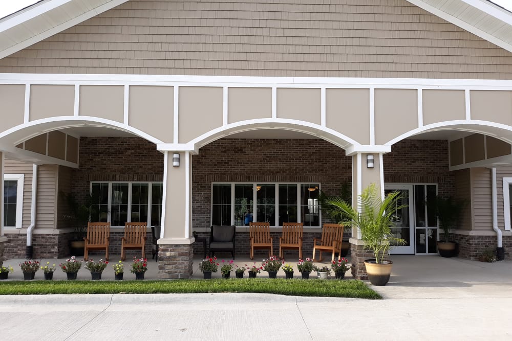 Outdoor porch with rocking chairs at Country Meadow Place in Mason City, Iowa