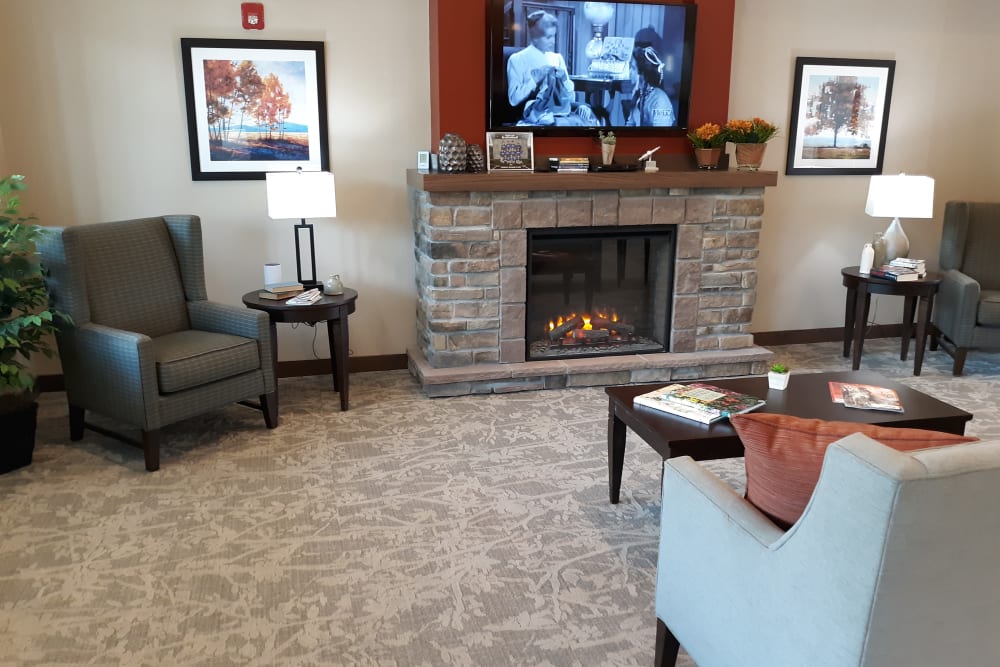 Community living space with fireplace at Country Meadow Place in Mason City, Iowa