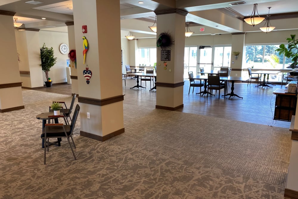 Brightly lit foyer with tables at Country Meadow Place in Mason City, Iowa