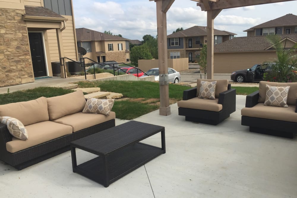A comfortable, outdoor community lounge at Alvadora Apartments in Lawrence, Kansas