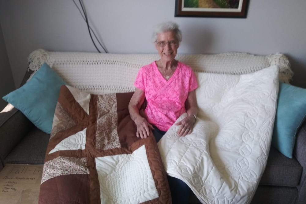 A resident displays her quilts at Arlington Place of Red Oak in Red Oak, Iowa