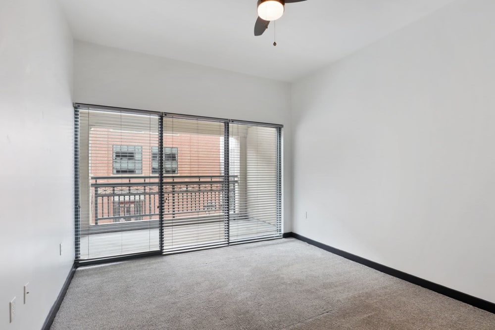 Bedroom with private balcony at 17th Street Lofts in Atlanta, Georgia