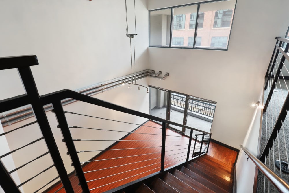 Stairs down to the first floor at 17th Street Lofts in Atlanta, Georgia