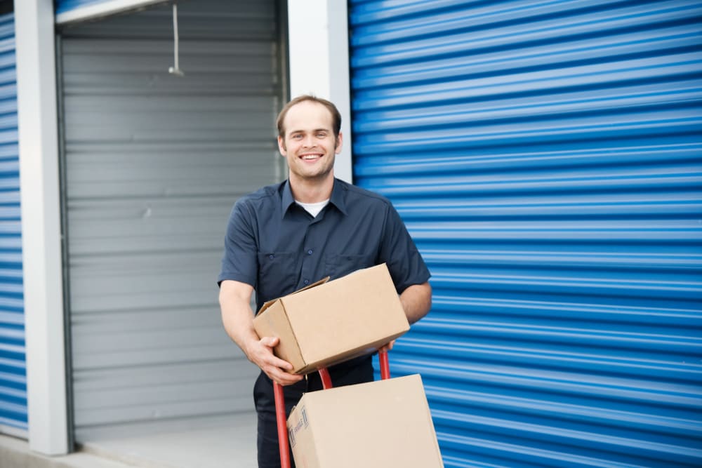 A man moving boxes at StayLock Storage in Warner Robins, Georgia