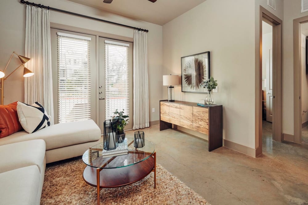 Comfortably furnished living area in a model home at The Guthrie in Austin, Texas