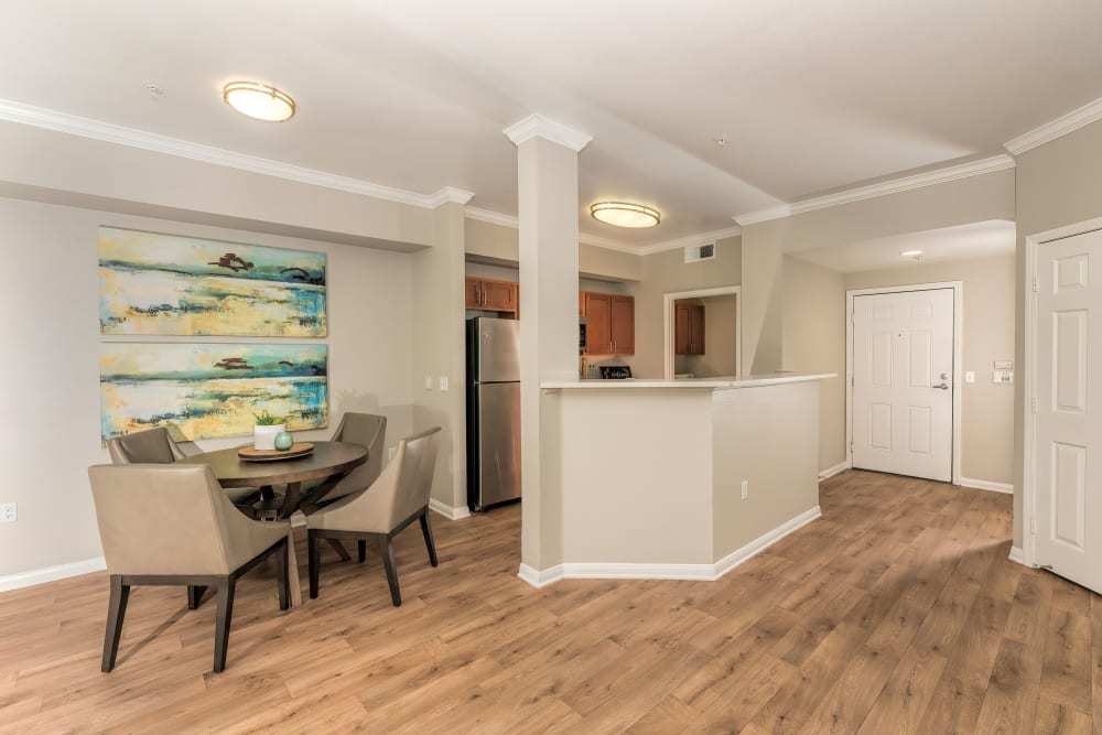 Dining room table and kitchen at Avion Apartments in Rancho Cordova, California