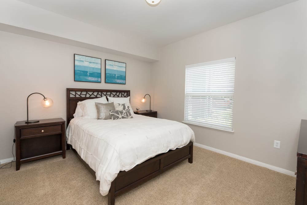 Large bedroom with a ceiling fan at Avion Apartments in Rancho Cordova, California
