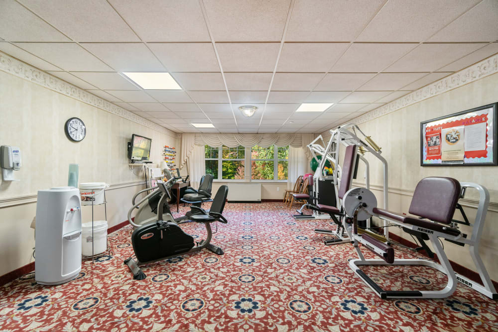 Exercise room with various equipment at The Hearth at Gardenside in Branford, Connecticut