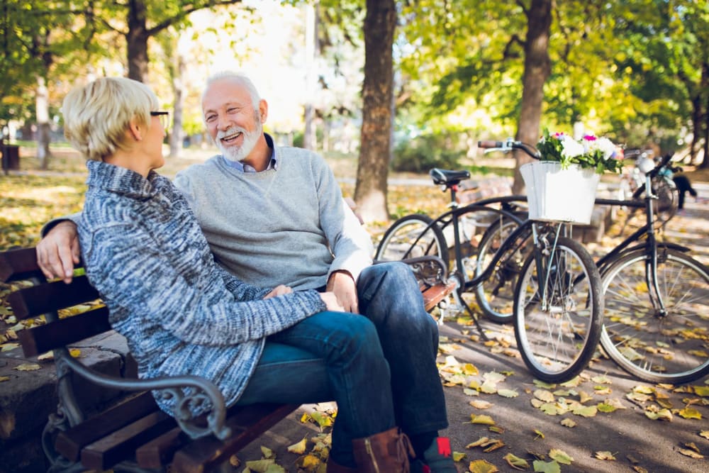 Residents sitting on a bench near Campus Commons Senior Living in Sacramento, California