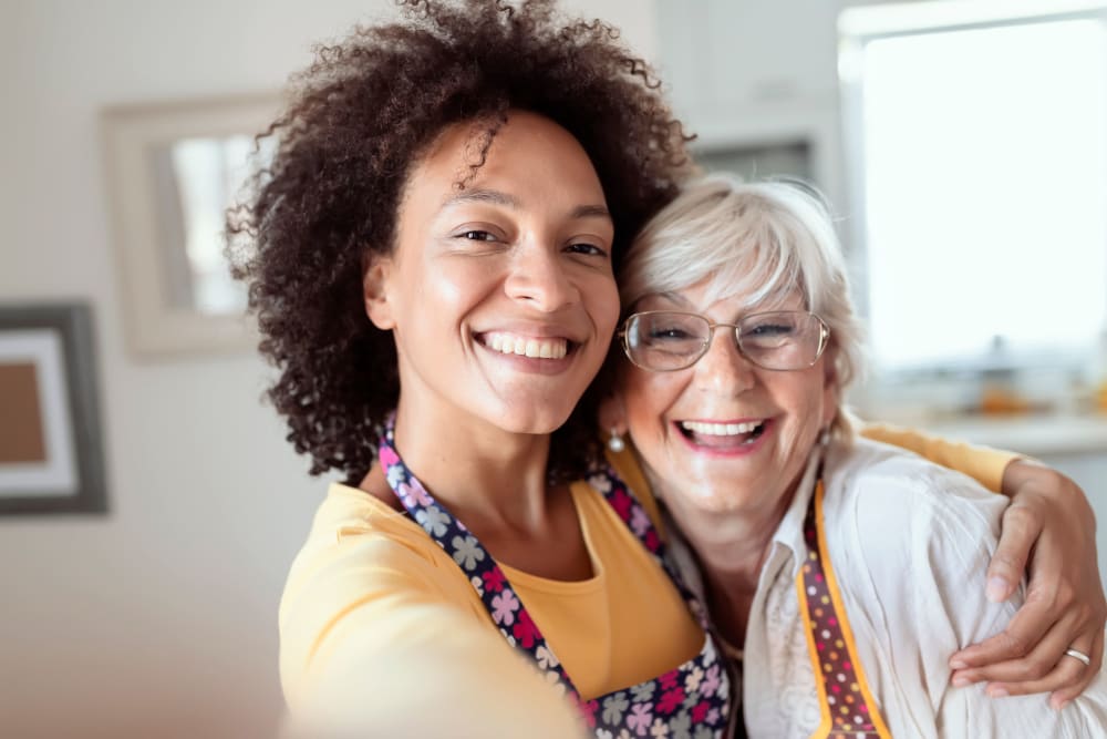 Careworker hugging a resident at Campus Commons Senior Living in Sacramento, California