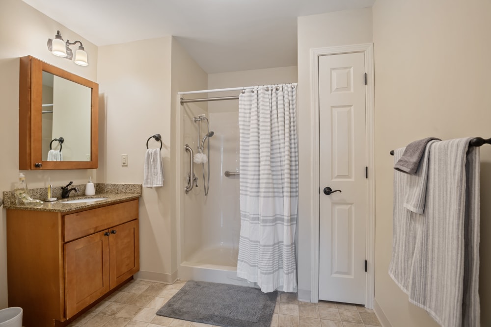 Bathroom with a standing shower in an apartment at The Hearth at Hendersonville in Hendersonville, Tennessee