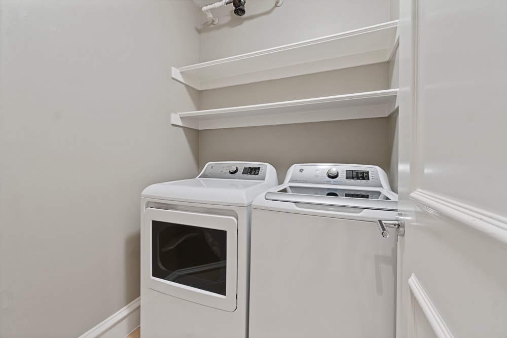 In-unit laundry room at Rienzi at Turtle Creek Apartments in Dallas, Texas