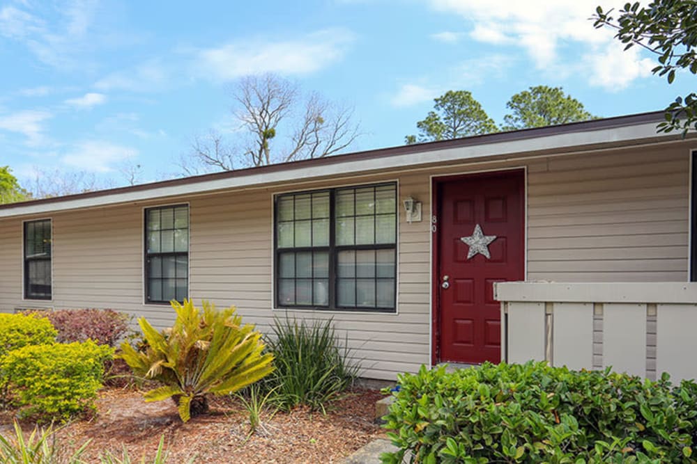 Bright red front doors at Stonewood Apartments in Jacksonville, Florida