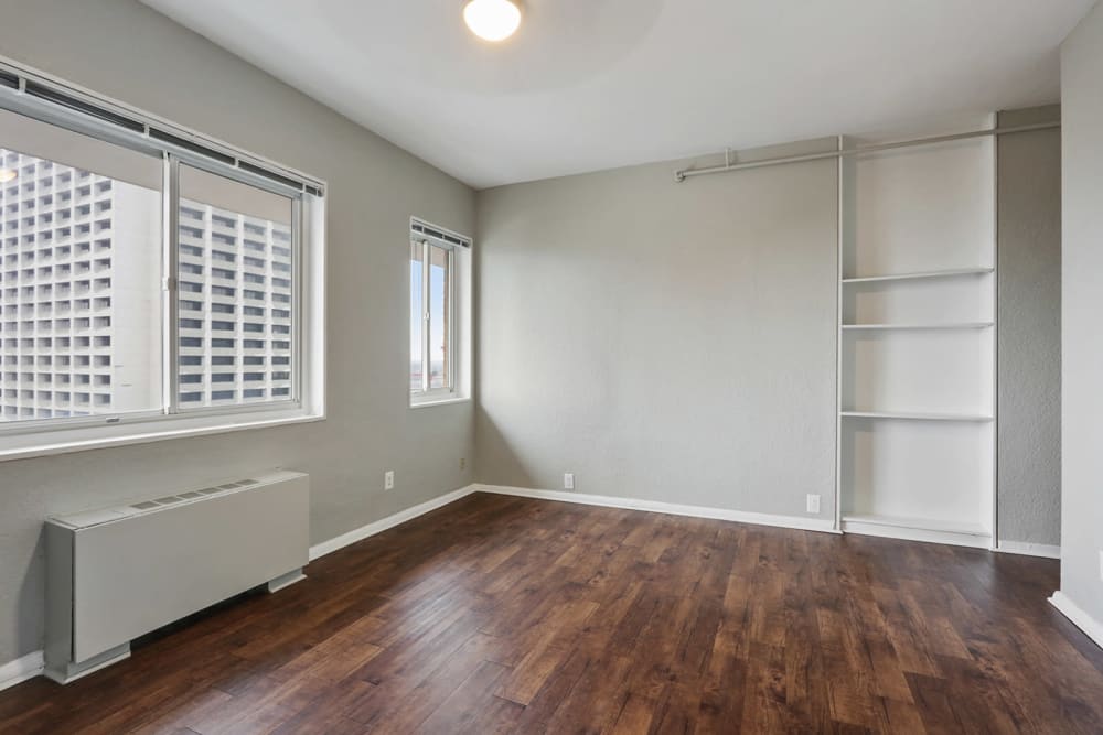 Bedroom with wood style flooring at Solace on Peachtree in Atlanta, Georgia