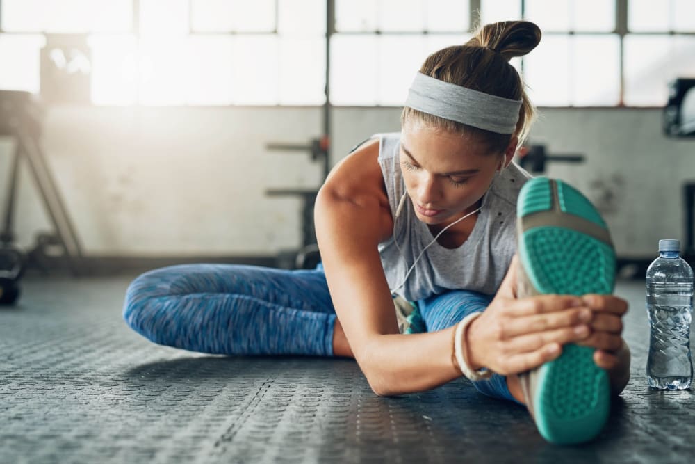 Resident stretching in Lakeview Residences' fitness center in Aurora, Illinois