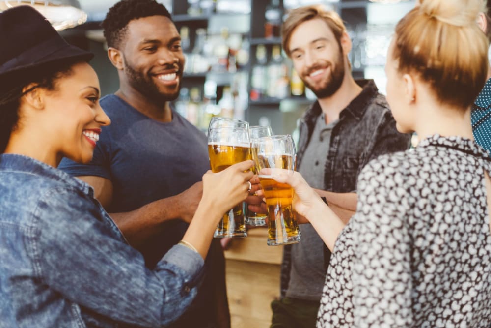 Friends hanging out at a local bar near Optimist Lofts in Atlanta, Georgia