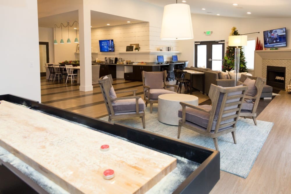 Shuffleboard in the spacious clubhouse at Metro on 5th in Saint Charles, Missouri