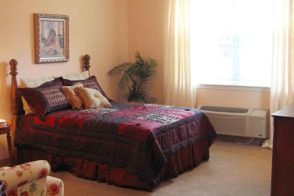 Resident bedroom at Grand Villa of Palm Coast in Palm Coast, Florida.