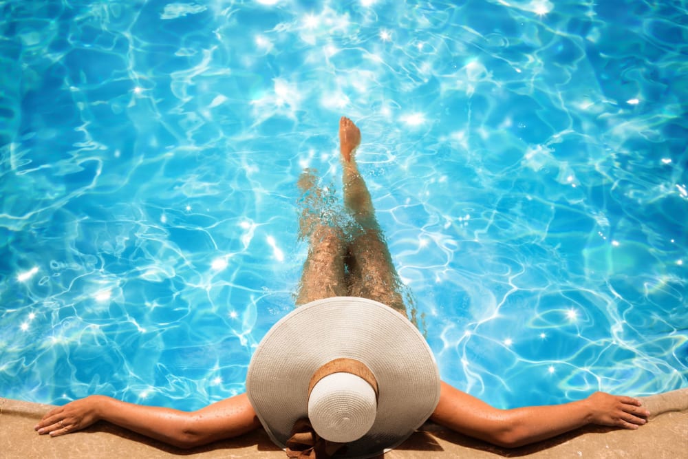 Resident relaxing in the pool at Autumn Ridge in Waukee, Iowa